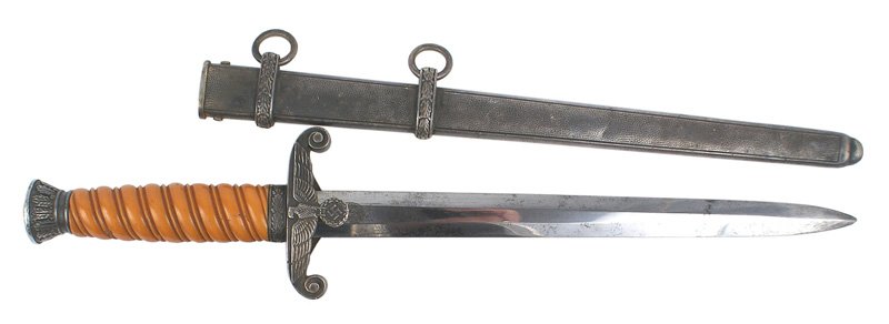 German WWII Army officer dagger: D-009 German WWII Army officer dagger. Deep orange grip. Darkened patina on the oak leaf decorated pommel/ferrule and eagle/swastika crossguard. Reverse is engraved with the owner's initials "JT". Bla