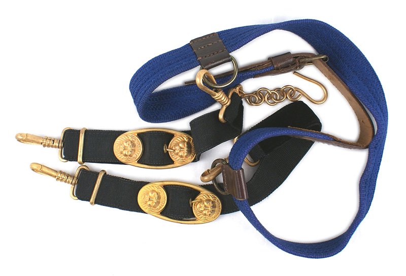 Kriegsmarine Officer inner dagger belt: D-040 Kriegsmarine Officer's inner dagger belt. Narrow blue web belt with a leather adjusting strap. Sewn on leather holders with "D" rings. Black ribbon hangers with gilt snap hooks, slides, lion hea