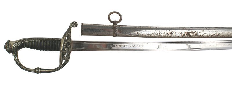 Spanish Infantry Officer sword: D-101 Spanish Infantry Officer's sword. Deeply grooved black hardwood grip. Silvered backstrap/pommel (decorated with oak leaves) and reverse "D" knuckle bow culminating in a wide pierced guard with a