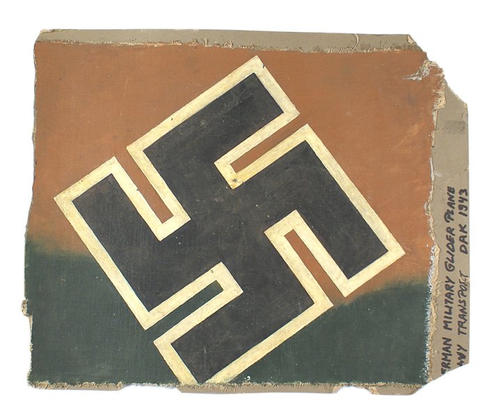 German WWII Transport Glider plane fabic: H-108 Desert camouflage fabric from the tail section of a German WWII Transport Glider, probably from a "Gotha". 19" x 16" green/brown painted camouflage fabric with a 11 7/8" x 11 3/4" white outlined