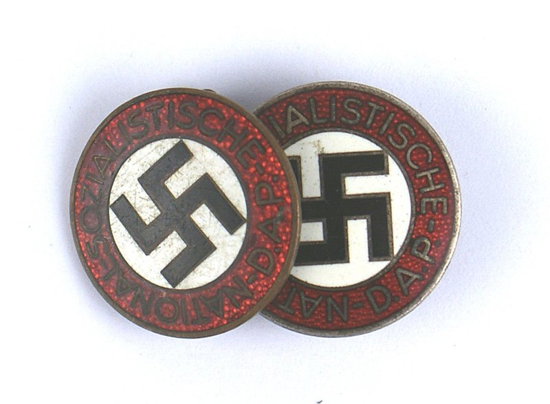 Lot 2 German WWII NSDAP member badges: B-032 Lot of 2 enameled German NSDAP member's badges. One is a pin-back (marked "RZM" and "M1/173") and the other is a buttonhole type (marked "RZM" and "M1/75"). II