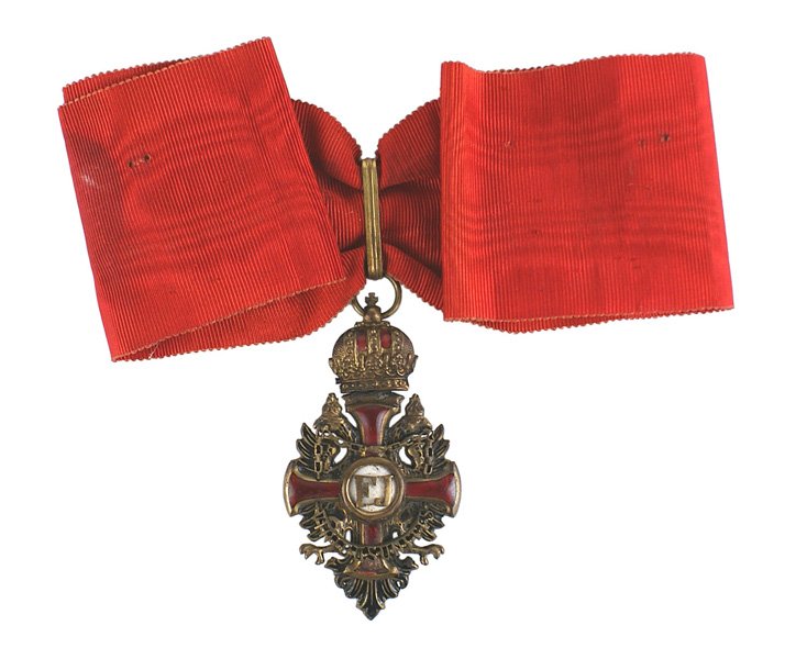 Austrian Order of Franz Joseph Badge: B-217 Austrian Order of Franz Joseph - Commander Cross neck badge. Wartime WWI Period in bronze gilt. Red enameled cross on a crowned double-headed black enameled eagle with an applied chain with lett
