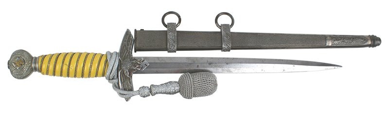 Luftwaffe Officer 2nd Model dagger: D-010 German WWII Luftwaffe Officer 2nd Model dagger. Oak leaf decorated pommel with a center swastika retaining some of the original gilt finish. Flying eagle/swastika crossguard. Silver wire wrapped