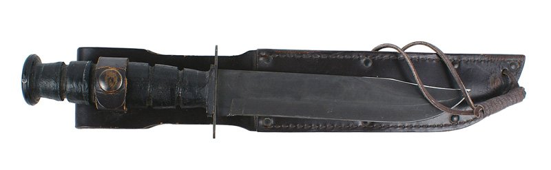 U.S. Navy Mark II combat knife: D-060 U.S. Navy Mark II combat knife. Similar to the Ka-Bar. Leather rings grip. Darkened steel round pommel and crossguard. 7 1/8" parkerized blade - marked "U.S ONTARIO". Black leather scabbard with
