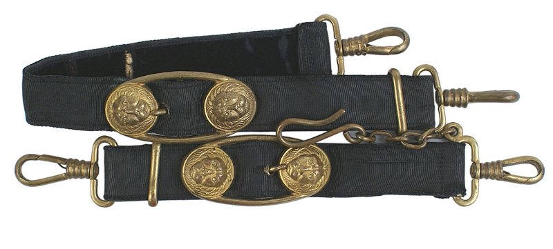 Imperial German Navy dress dagger hangers: D-067 Pair of WWI Imperial German Navy dress dagger hangers. Age toned gilt-brass lion head fittings on black brocade straps. II