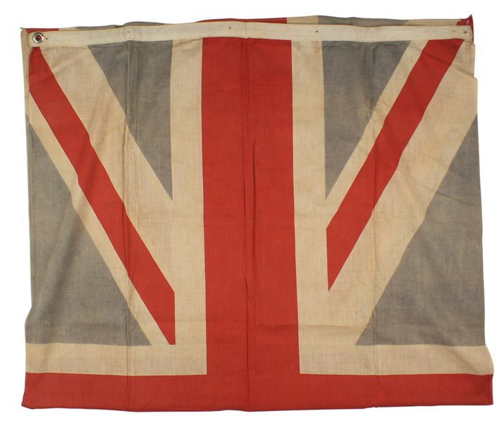 British WWII flag: H-127 British WWII flag. Faded from use. One of the two corner grommets remains. 32" x 56". II-