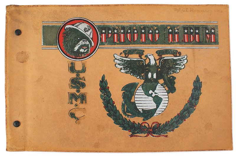 U.S. Marine Corps WWII photo album: L-012 U.S. Marine Corps WWII photo album. Colorful soft leather cover with the large EGA, oak leaves, "PHOTO ALBUM", portrait of helmeted dog mascot and "USMC". Ink named to "Sgt. G.E. Randall-USMC". 