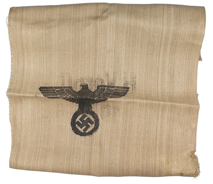 German WWII Army large supply bag: N-017 German WWII Army large supply bag. Heavy coarse burlap material with a large stenciled eagle/swastika and on reverse "H.Verpfl. 1944. 56" x 50". Partially stained and a "chewed" corner section. 