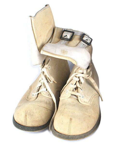 U.S. WWII Mountain Troops combat boots: N-040 U.S. WWII Mountain Troops 1943 service/combat boots. White suede with a 5 3/8" cuff with 2 white leather straps/buckles. "Rough" rubber soles and heels. Sides are indented to accommodate ski bin