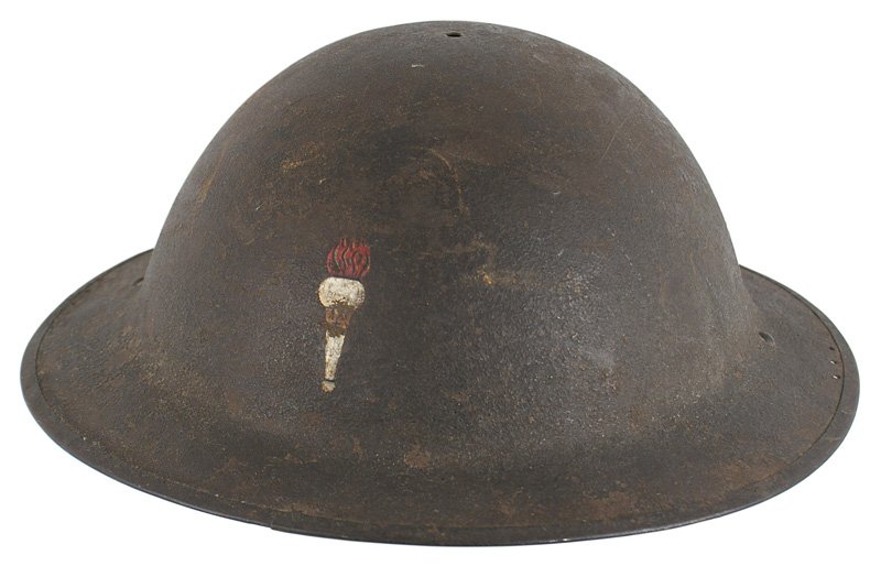 U.S. WWI doughboy helmet: E-042 U.S. WWI "doughboy" helmet. Dark OD sand finish with one dent on the reverse. Painted flaming torch on front. Missing liner and chinstrap. II