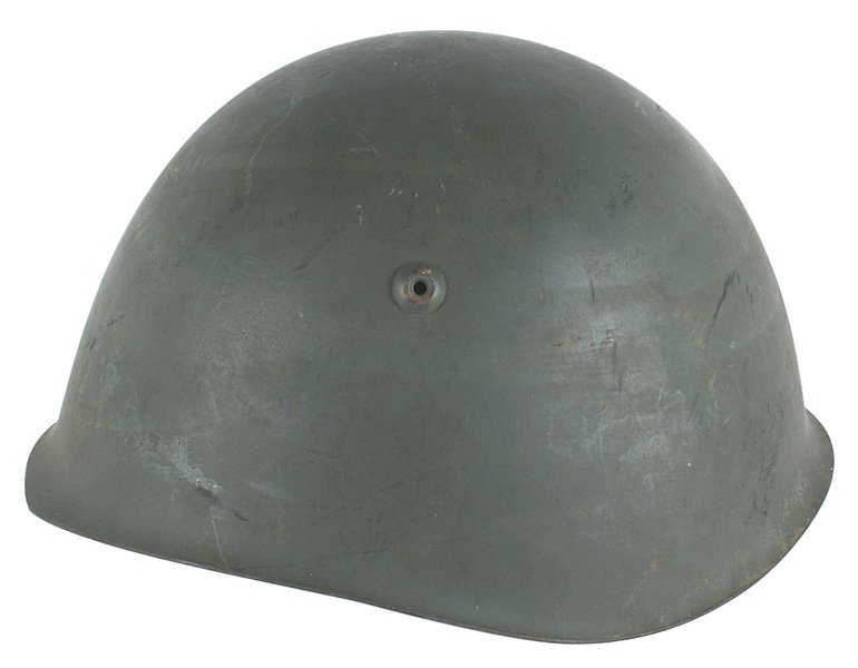 Italian WWII M35 helmet: E-063 Italian WWII M35 helmet. Original olive drab finish. Leather liner shows some expected wear. Chinstrap is intact. A good example. II+