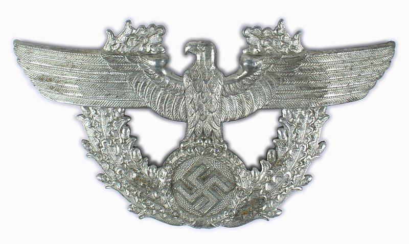 Third-Reich Police eagle: E-112 Third-Reich German Police eagle/swastika/oak leaf wreath shako badge. Reverse has two screw posts, washers and nuts. 3" x 6". II