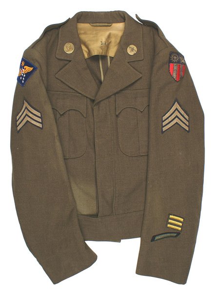 U.S. WWII Ike jacket 9th AF CBI: F-029 U.S. WWII "Ike" jacket. "U.S." and AF collar discs. 9th AF and bullion embroidered CBI patches. Also sergeant stripes and 18 months o'seas stripes. Faded area on lower right. About II
