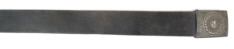 German WWII Army EM belt: F-050 German WWII Army EM belt and buckle. Relief eagle/swastika "GOT MIT UNS" and oak leaves on a steel buckle. 60% of the early green finish remains. Belt was cut down to 32". About II
