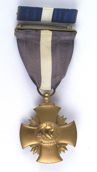 U.S. WWII Navy Cross medal: B-263 U.S. WWII Navy Cross. Full wrap brooch. Type II. Slightly faded ribbon. With ribbon bar. II+