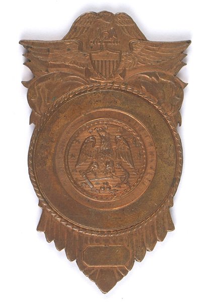 U.S. Navy Bronze Badge: B-386 U.S. Navy Bronze Badge Planchet. Police badge type with the traditional eagle/anchor in center with an eagle above a Navy winged shield/anchor, at the top. 2 7/8" x 1 3/4". II