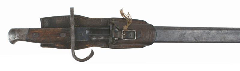 Japanese WWII Arisaka bayonet: D-043 Japanese WWII Arisaka bayonet. Wood grips with a steel "bird head" pommel and curved downward quillon/muzzle ring crossguard. Except for the sharpened edge, the blade retains 90% of the original