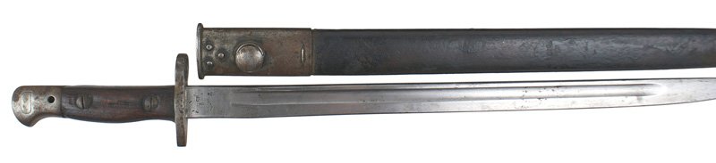 Great Britain pattern of 1907 bayonet: D-057 Great Britain pattern of 1907. Age darkened steel pommel and crossguard/muzzle ring. 17" blade is graying and shows some age. Marked with the British Crown, "1907", hallmarks, "US". Small rust p