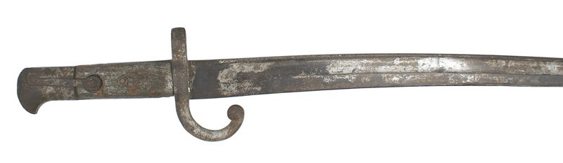 Turkish NCO bayonet Peabody Martini Rifle: D-066 Turkish NCO's bayonet for the M1874 Peabody Martini Rifle. Pommel (missing the press stud) and crossguard are aged, rusted, and have residue of old paint. Wood grips were replaced some time ago.