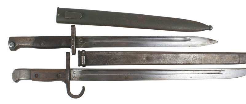 Lot of 2 bayonets Austrian Mannlicher Japanese: D-067 Lot of 2 bayonets: (1) Austrian Mannlicher bayonet. Steel fittings with plain wood grips. 11 7/8" graying blde. OD steel scabbard with a typical Austrian frog hook. (2) Japanese Arisaka Model 18
