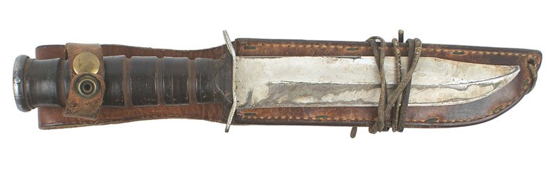USMC combat knife: D-070 USMC combat knife. Flat steel pommel and leather rings grip. Crossguard marked "U.S.M.C." and "CAMILLUS, N.Y.". 6 7/8" blade has an aged period type silver-gray paint finish. Original leather sc
