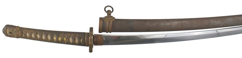 Japanese WWII Army sword: D-089 Japanese WWII Army "Mantetsu". White sharkskin grip with brown cord lacing. Typical gilt lotus blossom menuki, floral decorated pommel cap and ferrule and pierced lotus blossom decorated age ton