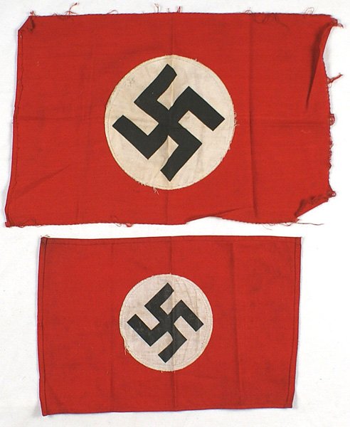 Lot of 2 small German WWII NSDAP flags: H-100 Lot of two small German WWII NSDAP flags. Both have a printed swastika on a white disc, sewn to a red field. Both are double sided. One is 9 1/2" x 14" (worn borders) and the other is 8" x 11 1/