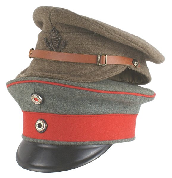 Lot 2 reproduction caps British Prussian: H-206 Lot of two quality made reproduction caps: (1) British WWI all cloth peaked cap. "CONNAUGHT RANGERS" badge and brown leather chinstrap. (2) Prussian peaked cap: OD with a red band and piping. Tw