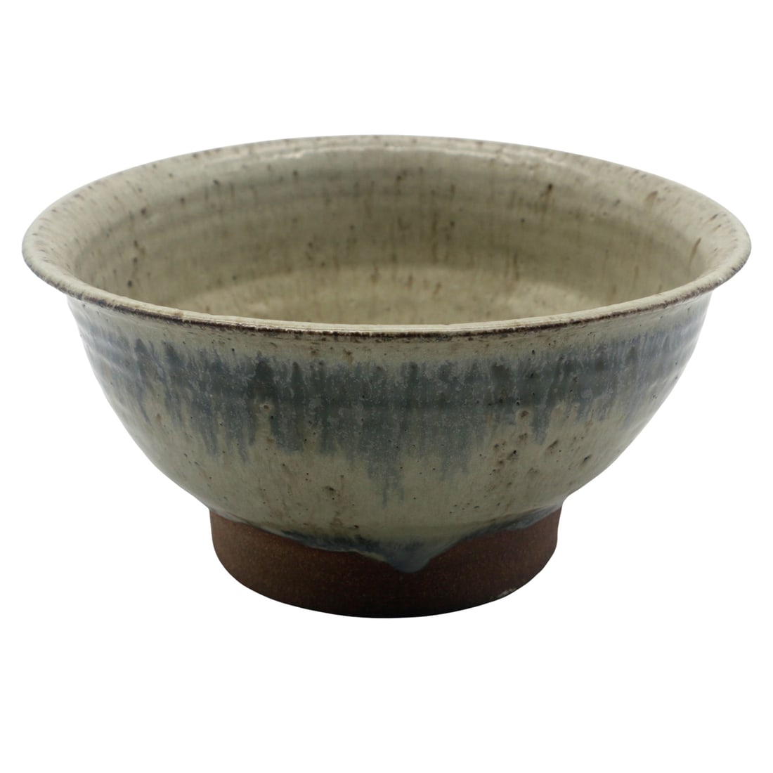 Studio Stoneware Bowl with Oatmeal & Blue-Gray Drip Glaze, c. mid/late 20th C.: Wheel-thrown studio stoneware bowl with a satin oatmeal glaze washed in blue-gray drips that break warmly over the shoulder, finishing in a natural clay foot. An easy, sculptural form with subtle spec