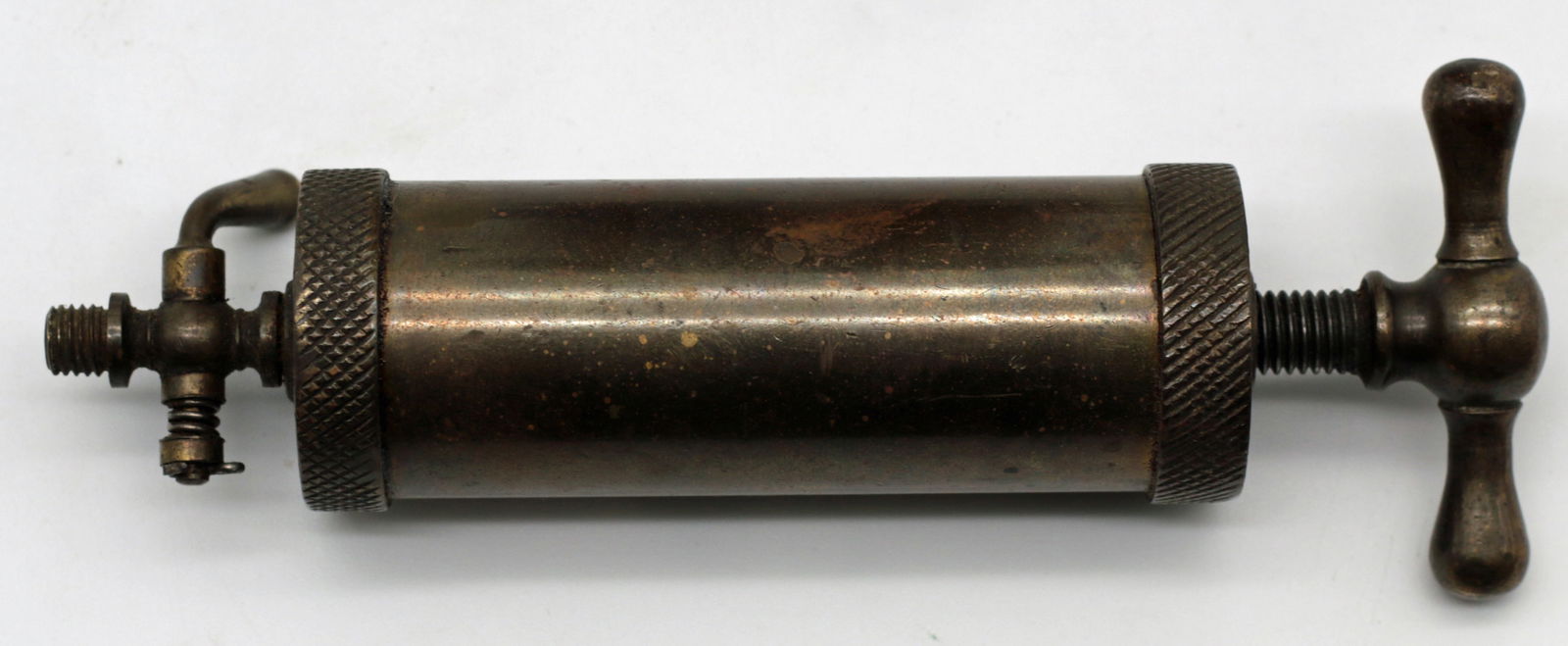 19th Century U.S. Patent Model Brass and Copper Reservoir with Dual Stopcocks and Miniature Plunger: Summary Authentic 19th century United States Patent Office model composed of a cylindrical brass and copper reservoir mounted on a turned hardwood base with two opposing stopcocks, accompanied by a se