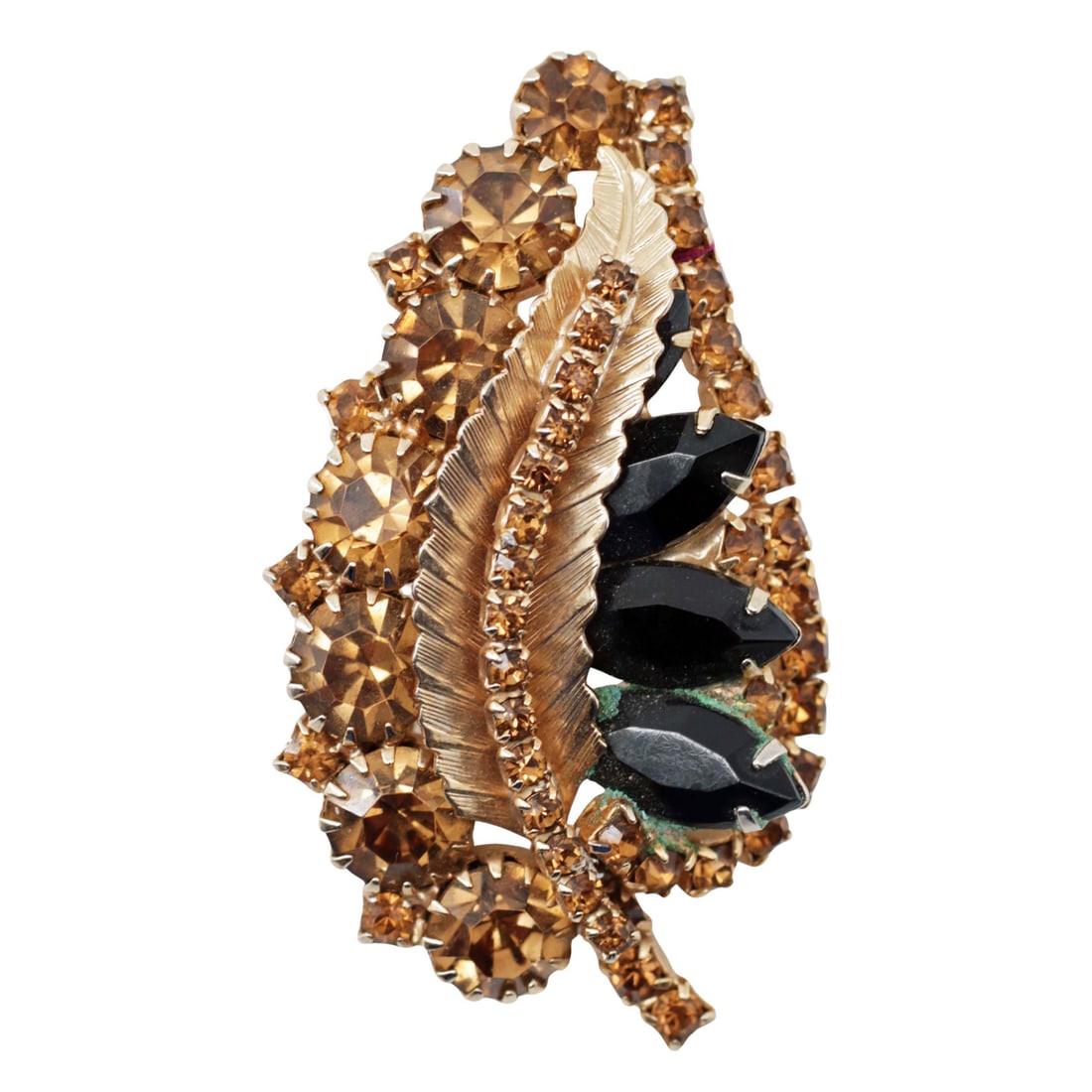 Juliana Style Amber Rhinestone Gold Leaf Brooch: Summary This mid-century rhinestone brooch features warm amber and topaz-toned chatons arranged in a sweeping leaf form. A textured gold-tone feather or leaf element runs diagonally through the compos