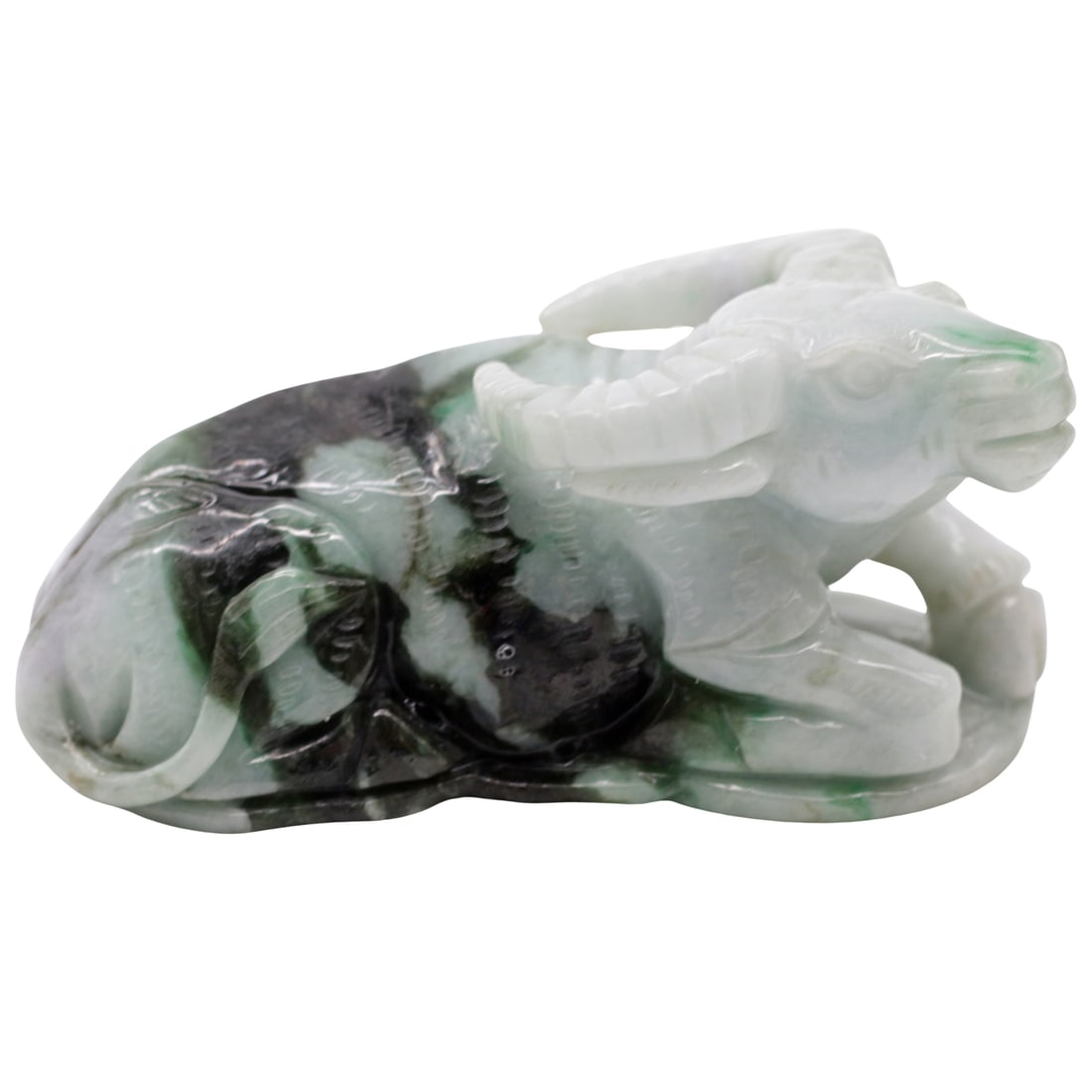 Chinese Carved Jade Recumbent Ram: Identification Chinese carved jade recumbent ram, late 20th century (PRC period). The figure is carved in the round with curled horns and a relaxed pose, worked from a mottled stone displaying celadon