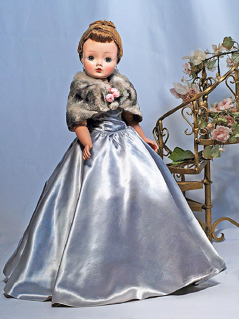 52. ALEXANDER CISSY IN SILVER-BLUE SATIN GOWN.  20". (1 of 1)