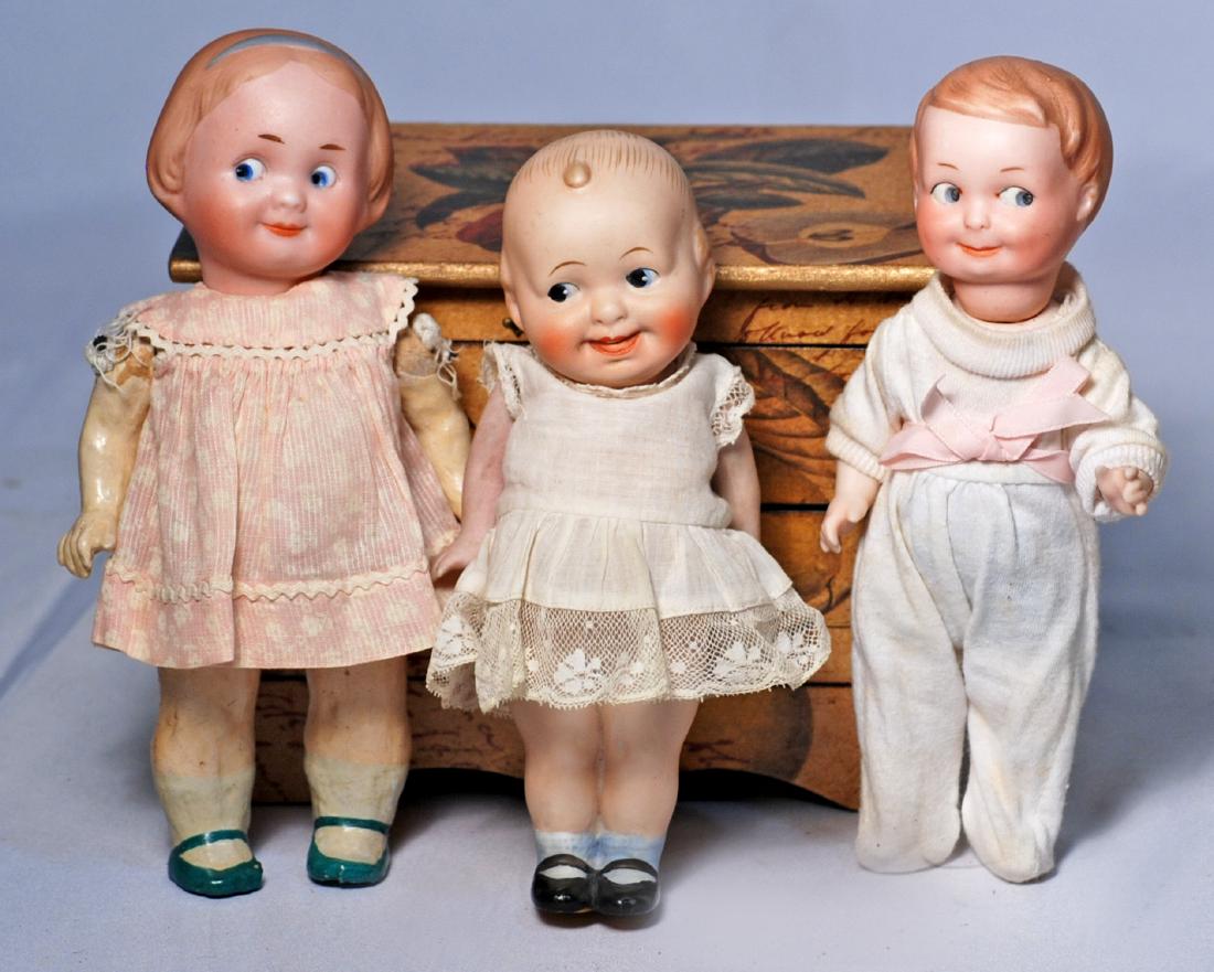 *83.  THREE PAINTED-EYE GERMAN BISQUE GOOGLIES.  (1) 7 (1 of 1)