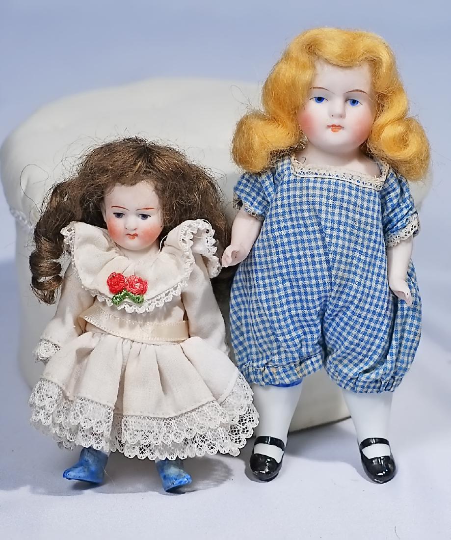 173.  TWO GERMAN ALL-BISQUE DOLLS. 4" doll marked 520; (1 of 1)