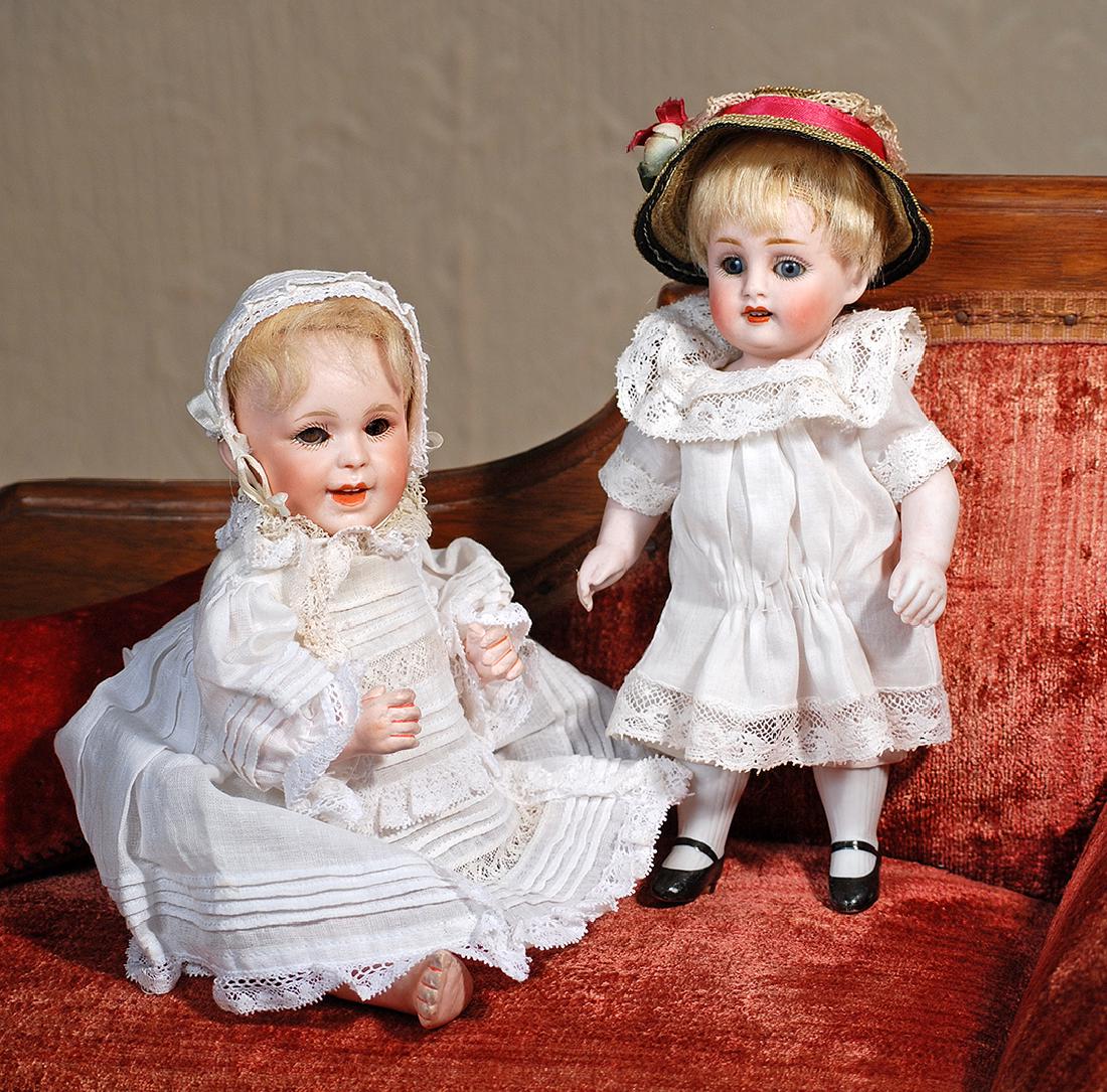 GERMAN ALL-BISQUE DOLL BY KESTNER. Marks: 150: GERMAN ALL-BISQUE DOLL BY KESTNER. Marks: 150 (incised); Kester crown label (on chest). 7 ½". All-bisque doll jointed shoulders and hips, blue sleep eyes, painted lashes, feathered brows, open mouth,