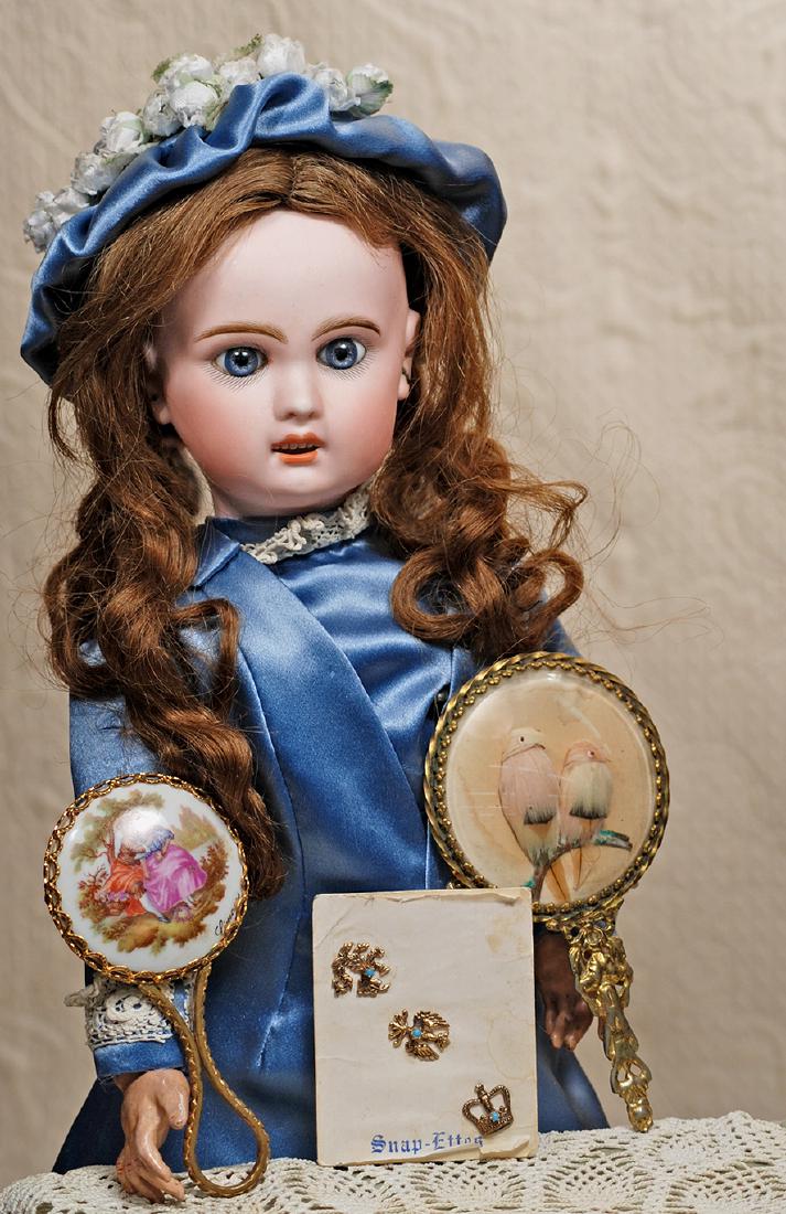 PRETTY BLUE-EYED FRENCH BISQUE BEBE BY JUMEAU. Marks:: PRETTY BLUE-EYED FRENCH BISQUE BEBE BY JUMEAU. Marks: 7 18". Bisque socket head, blue paperweight eyes, painted lashes, feathered and brushstroked brows, pierced ears, open mouth, shaded and accented 