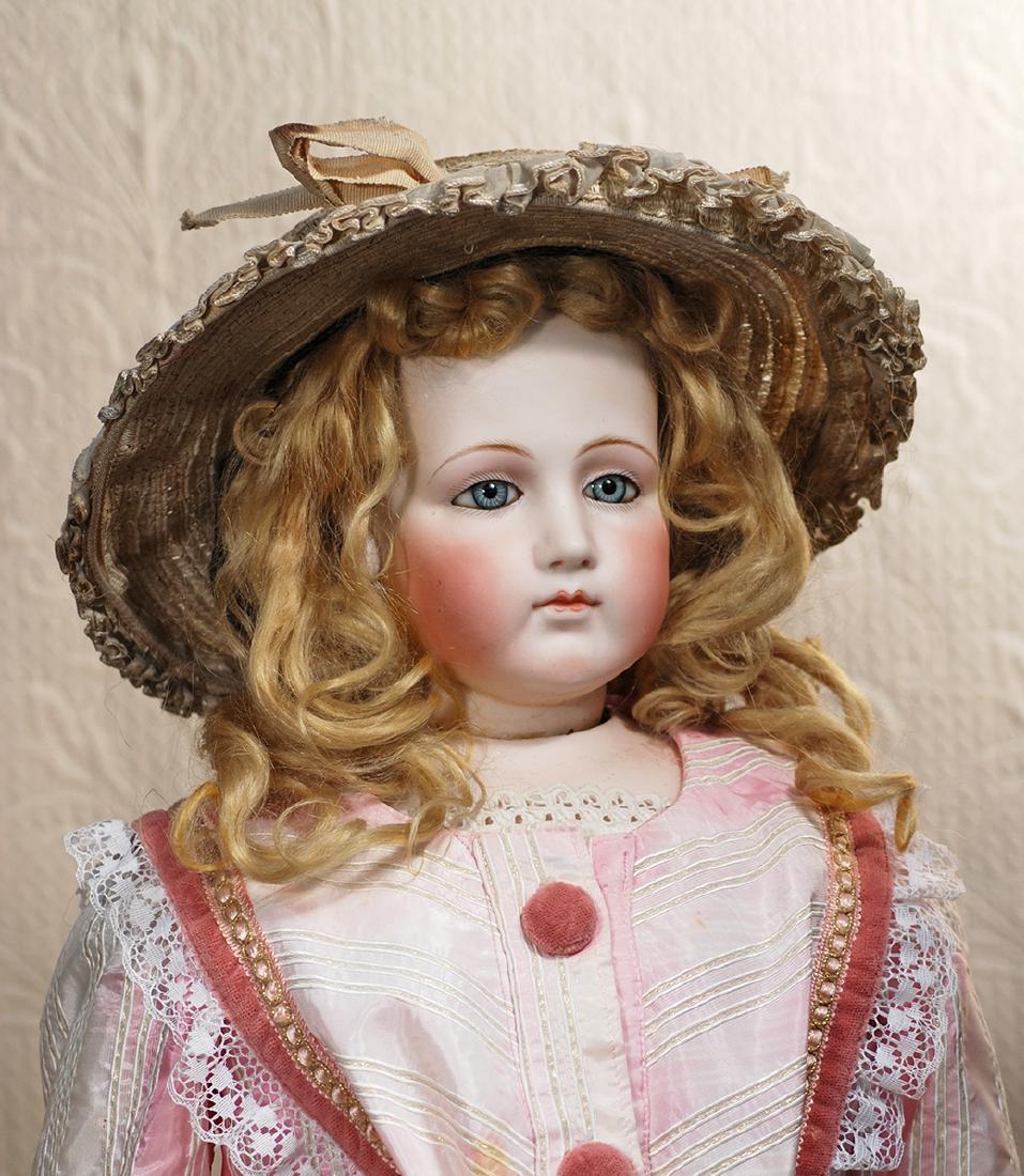 MAGNIFICENT FRENCH BISQUE PORTRAIT POUPEE BY: MAGNIFICENT FRENCH BISQUE PORTRAIT POUPEE BY PIERRE-FRANCOIS JUMEAU. 33". Pressed bisque swivel head on bisque shoulderplate, inset blue glass enamel eyes, dark eyeliner, painted lashes, mauve-blushed