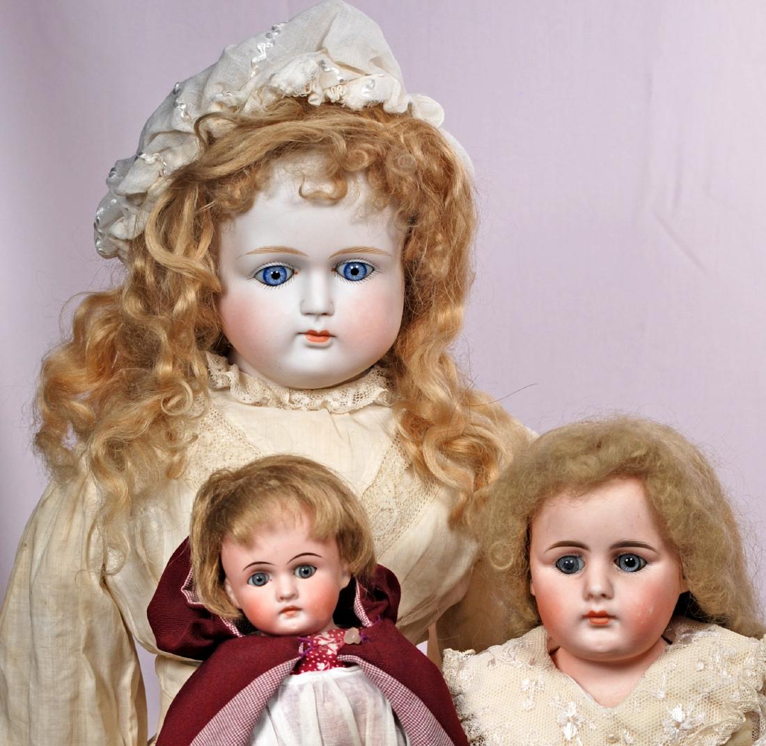 254. THREE GERMAN BISQUE SHOULDERHEAD DOLLS WITH CLOSED (1 of 2)