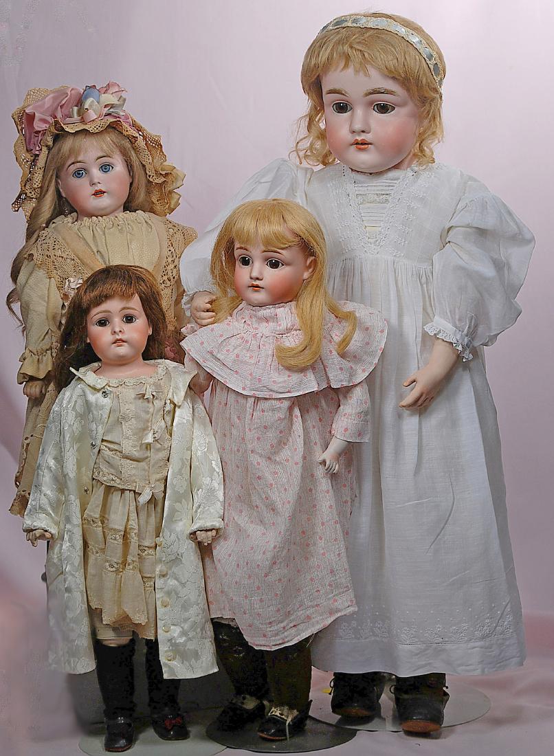 294. FOUR GERMAN BISQUE SHOULDERHEAD DOLLS BY KESTNER. (1 of 2)
