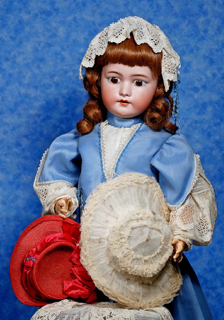 189. TWO DOLL BONNETS. Red woven straw bonnet with (1 of 2)