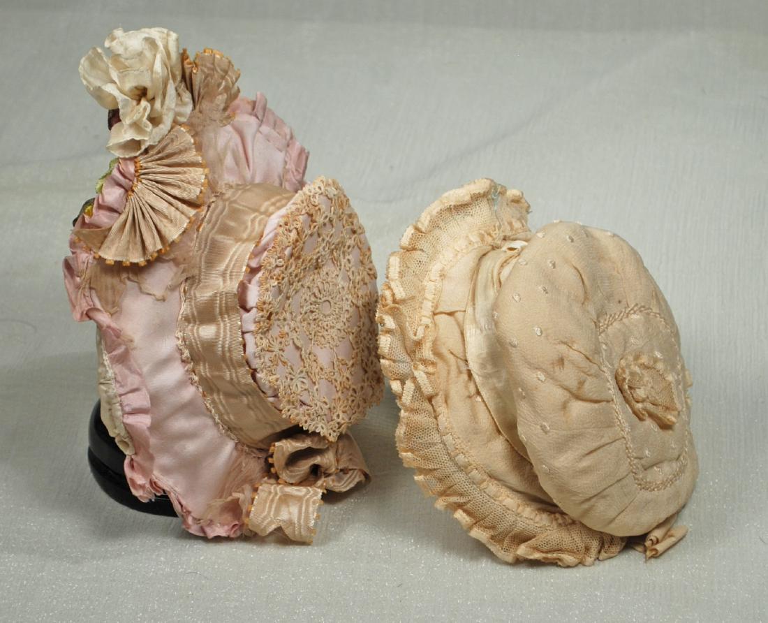 30. TWO ANTIQUE SILK DOLL BONNETS. Padded silk bonnet (1 of 1)
