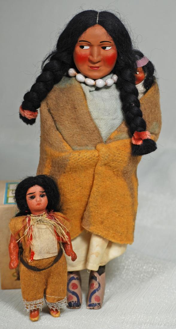 69. TINY BISQUE NATIVE AMERICAN DOLL & SKOOKUMS DOLL. (1 of 1)