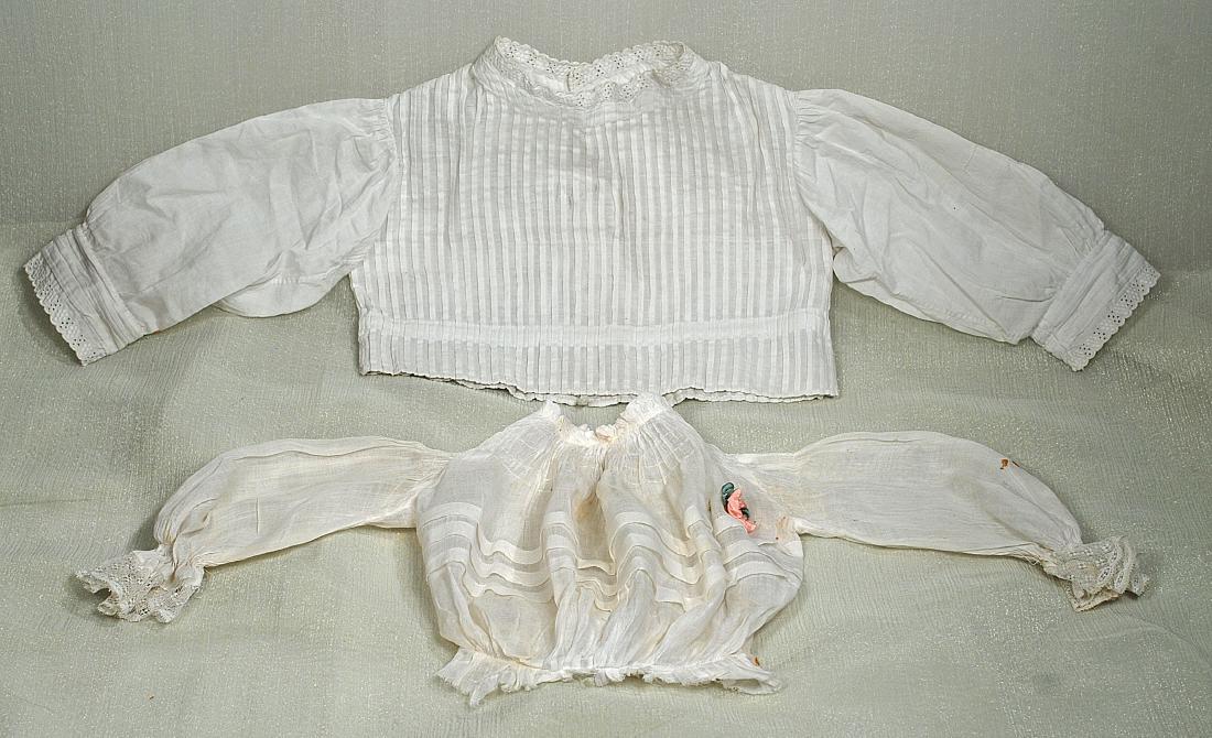 75. TWO ANTIQUE DOLL BLOUSES. White cotton blouse with (1 of 1)
