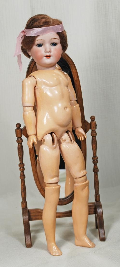 122. GERMAN BISQUE DOLL BY MARSEILLE. Marks: A.M. 390.: 122. GERMAN BISQUE DOLL BY MARSEILLE. Marks: A.M. 390. 19”. Bisque socket head, blue sleep eyes, painted and applied lashes, feathered brows, open mouth, upper teeth, original brown mohair wig,