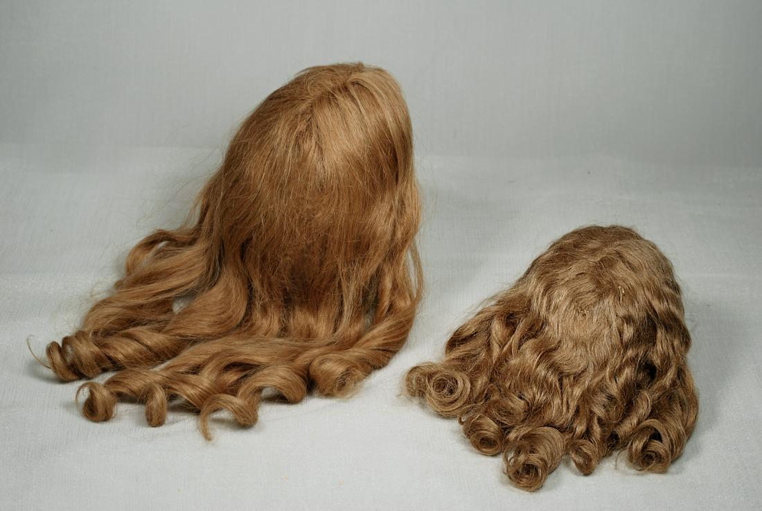 168. TWO ANTIQUE DOLL WIGS. Soft light brown mohair (1 of 1)