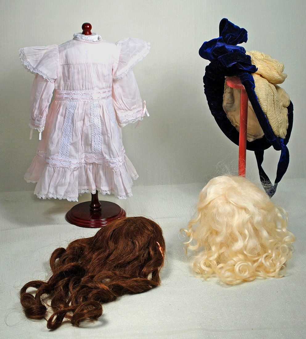 FANCY DOLL BONNET, TWO DOLL WIGS, DRESS AND SLIP. . (1 of 1)