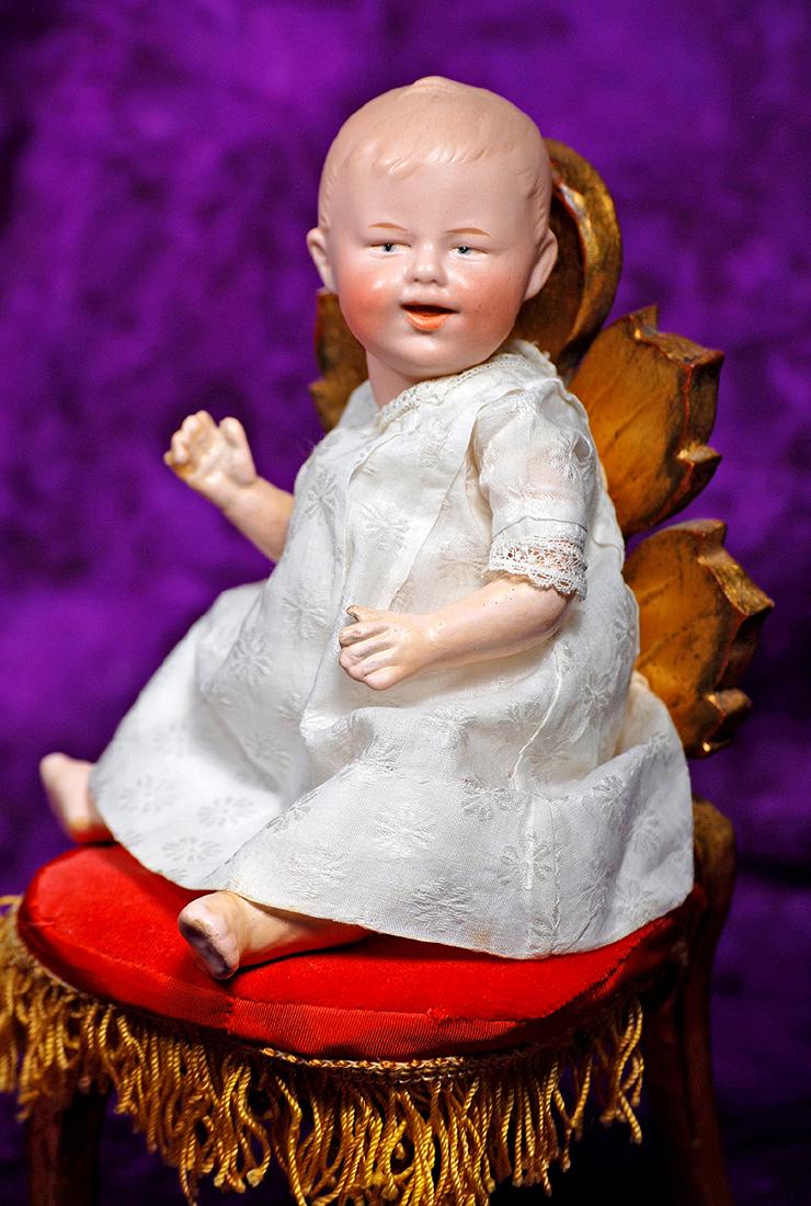 33. GERMAN BISQUE LAUGHING CHARACTER, 7911, BY GEBRUDER: 33. GERMAN BISQUE LAUGHING CHARACTER, 7911, BY GEBRUDER HEUBACH. Marks: Heubach 7911. 9”. Solid dome bisque socket head, light brown sculpted hair, narrow painted blue intaglio eyes with defined