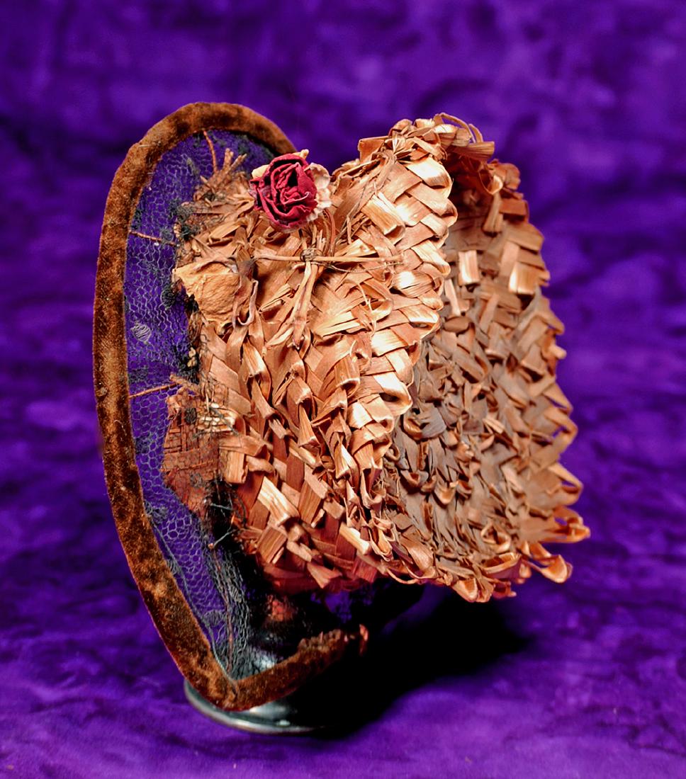 60. ANTIQUE FRENCH BONNET WITH “VICHY”: 60. ANTIQUE FRENCH BONNET WITH “VICHY” LABEL. 3” inside cap width. Woven straw bonnet with high shaped and flared crown, black point d’esprit brim, wired brown velvet edge, flo