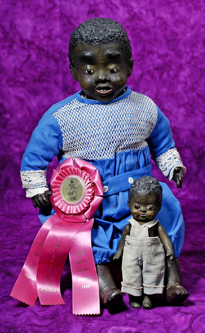 159. BLACK PAPER MACHE PORTRAIT CHILD WITH RARE: 159. BLACK PAPER MACHE PORTRAIT CHILD WITH RARE SCULPTED TEETH BY LEO MOSS. Marks: None. 20". Black paper mache swivel head with flange neck, rich dark brown complexion, sculpted and very tightly curl
